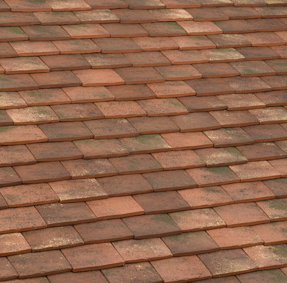 Gabarre blend 20x30 clay tiles showing rich reds and browns with a textured old-world finish.