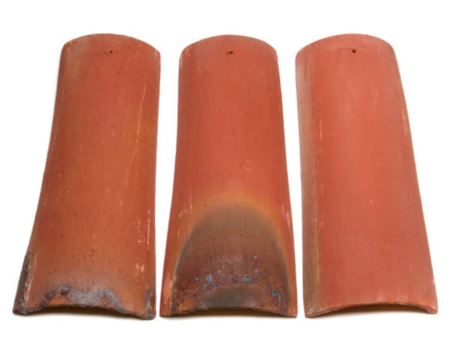 3 clay roof tiles showing the color blend and weathered finish of Antico Red
