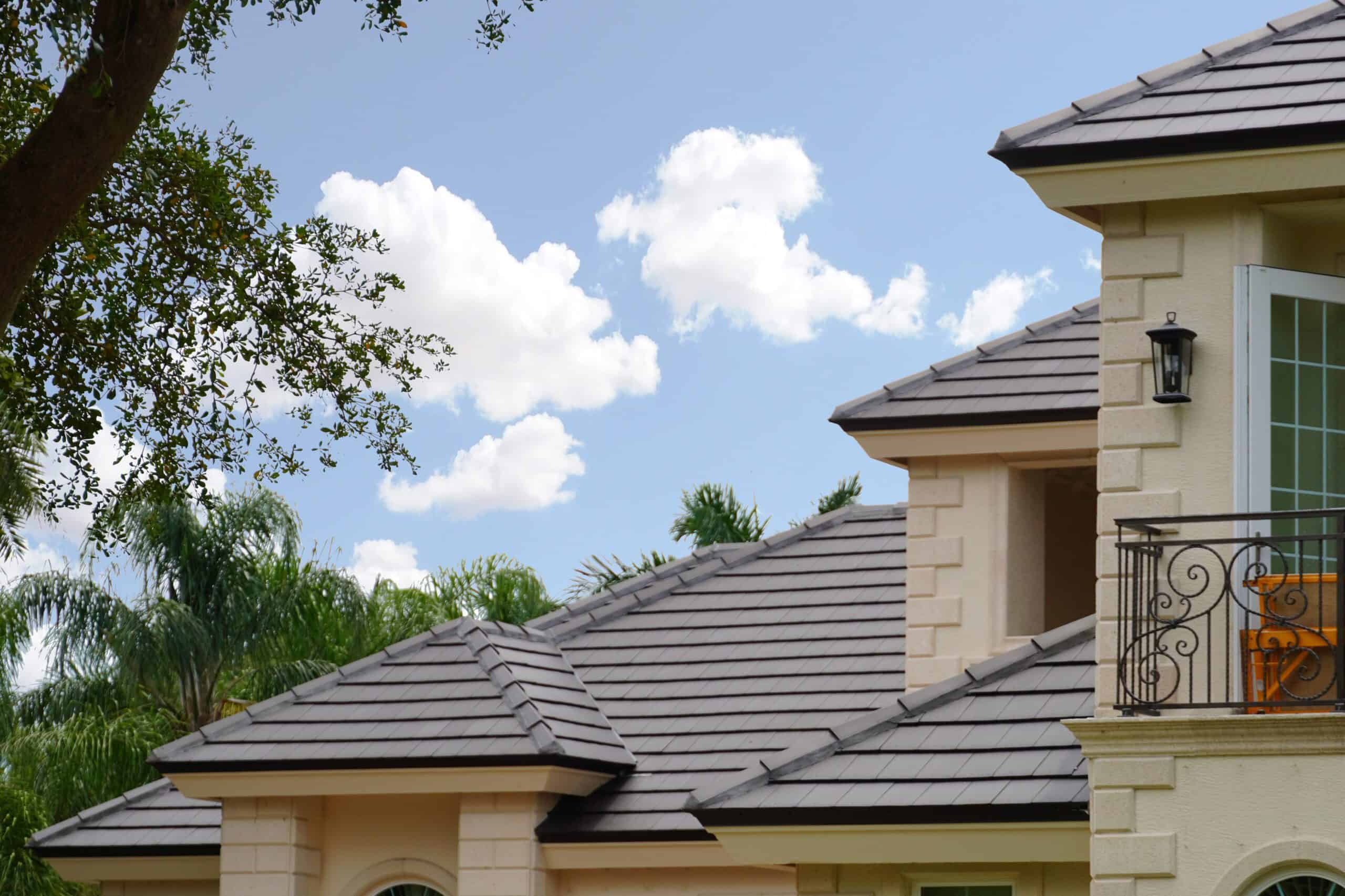 Looking At A House Using Verea Flat Clay Roof Tiles in Slate Color
