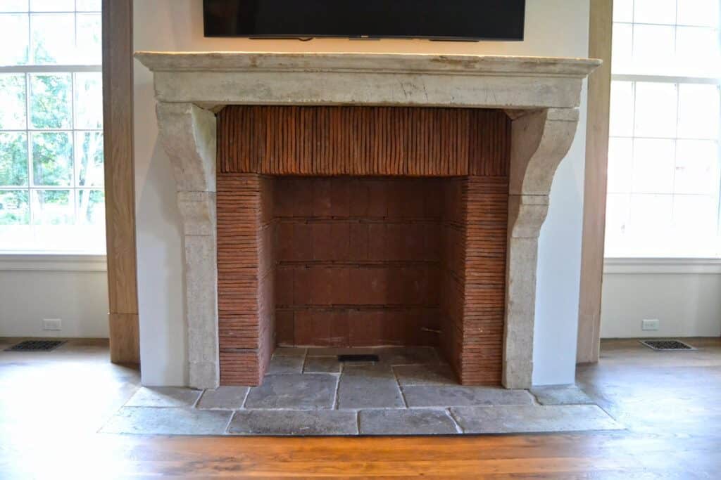 Clay tiles used as a fireplace surround. Designed by John Toates Architecture & Design LLC