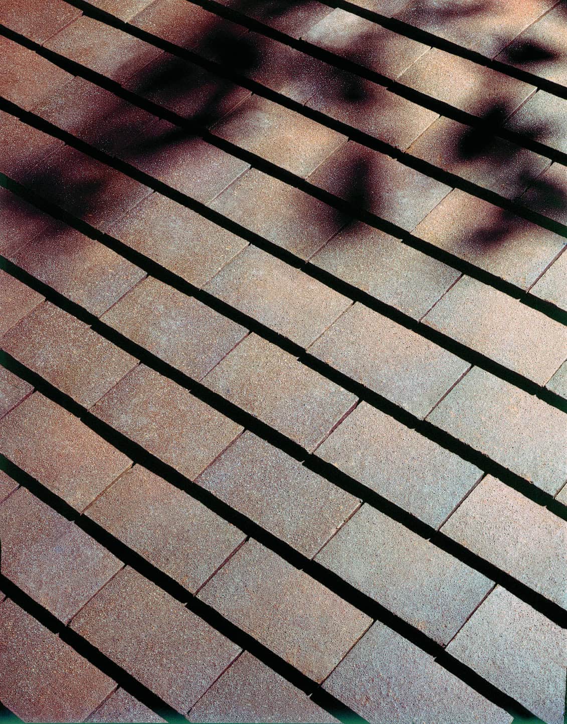 Dreadnought clay shingle tiles in Brown Heather with a sand finish surface