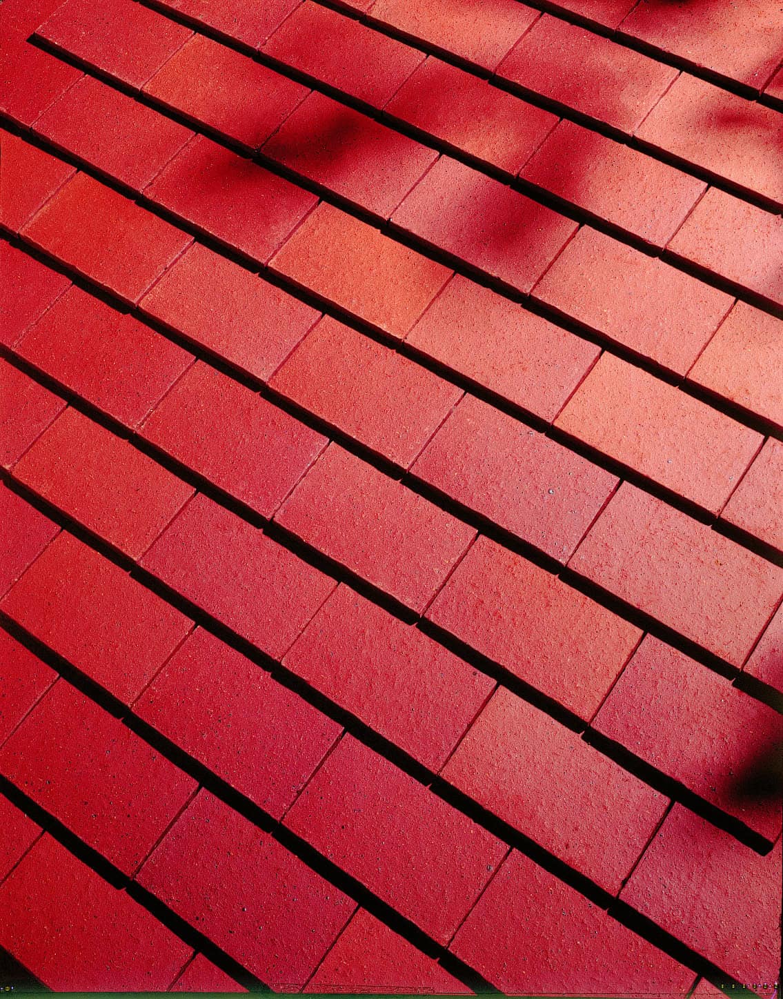 Dreadnought Single Tiles in Plum Red with a smooth finish