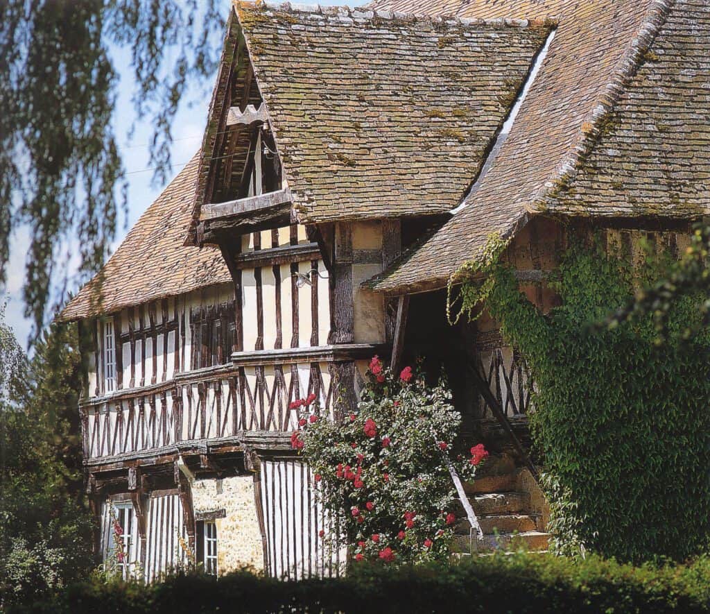 Half-timbered historic home with steep clay tile roof