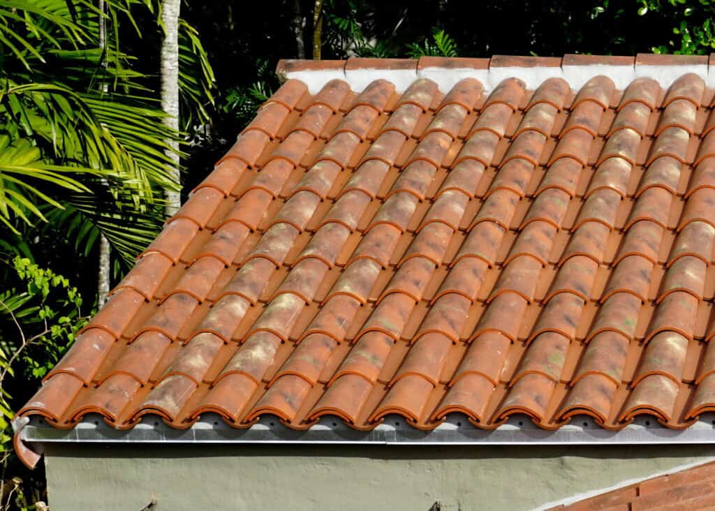 Traditional Mediterranean-style home with Verea Mission Pan & Cover clay roof tiles.