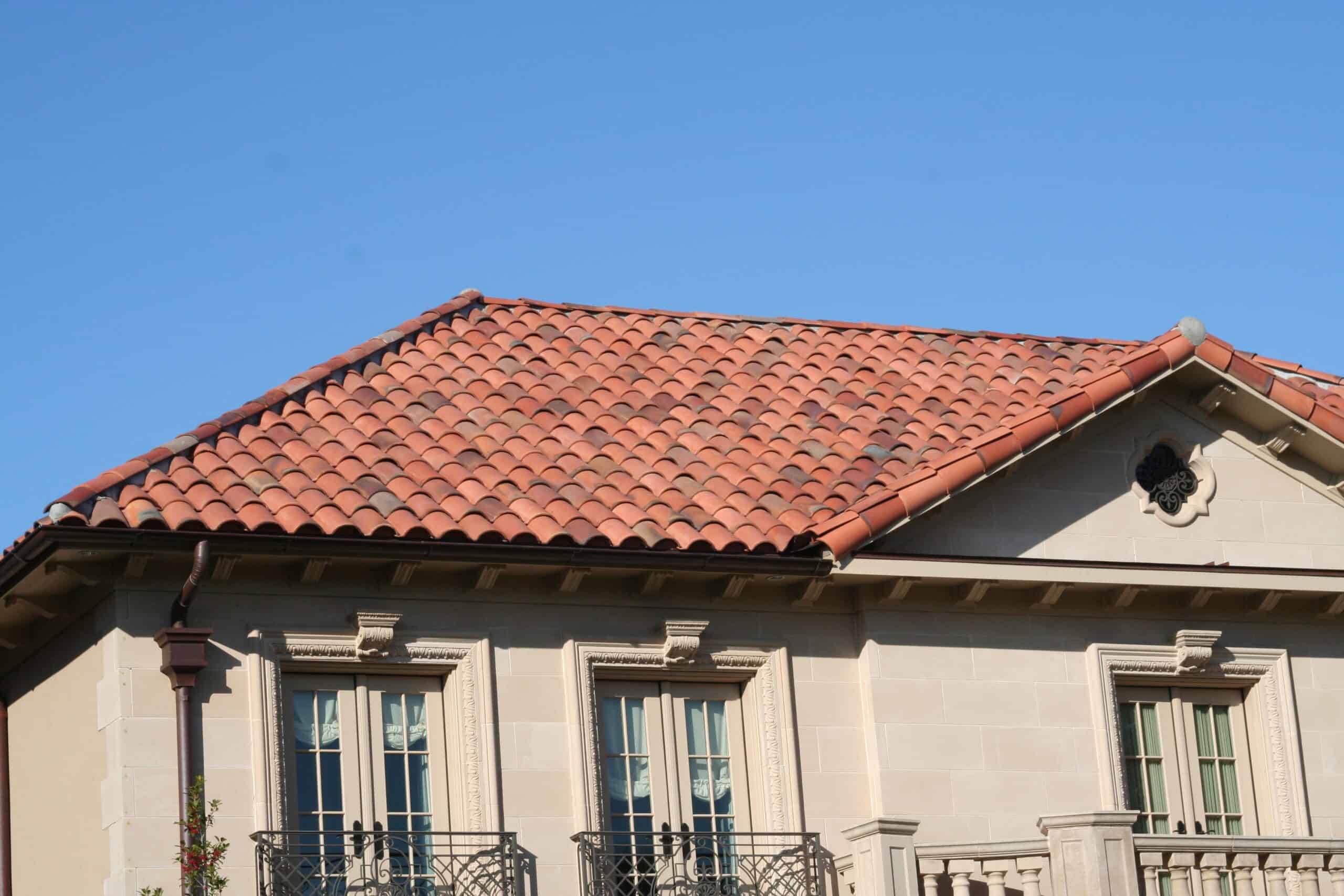 Colonial Spanish style house with red Mission clay roof tiles.