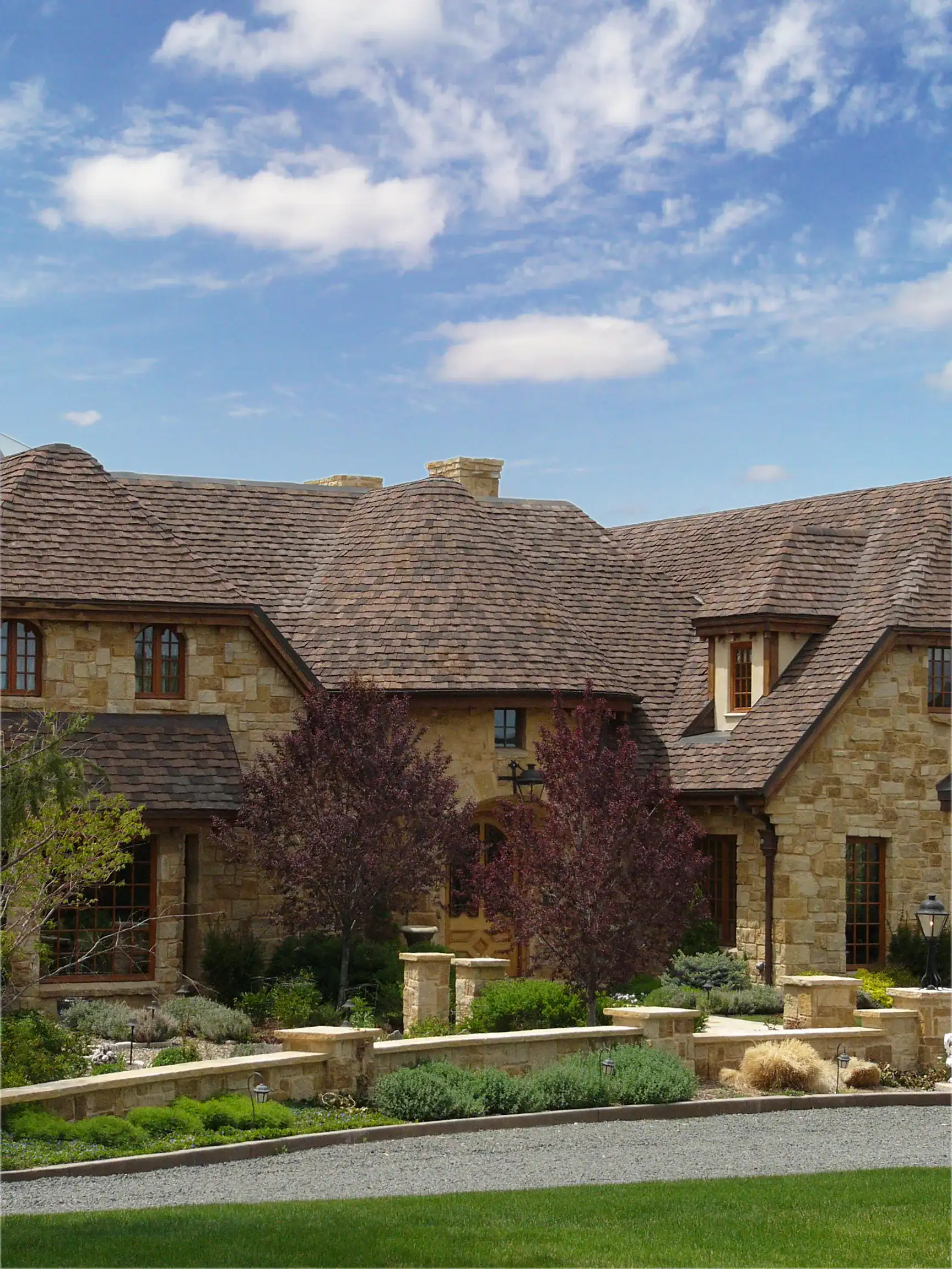 Luxury Cherry Hills home roofed with aged brown clay tiles for classic Colorado architecture