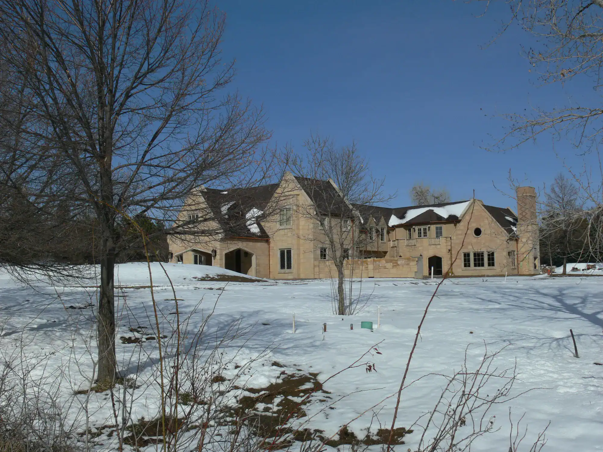 Snow-Covered Denver Home with Clay Roof Tiles