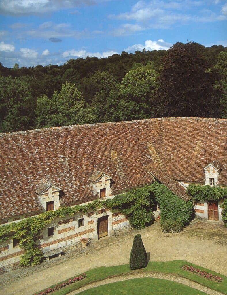 Historic clay tile roof on traditional manor house in Normandy France