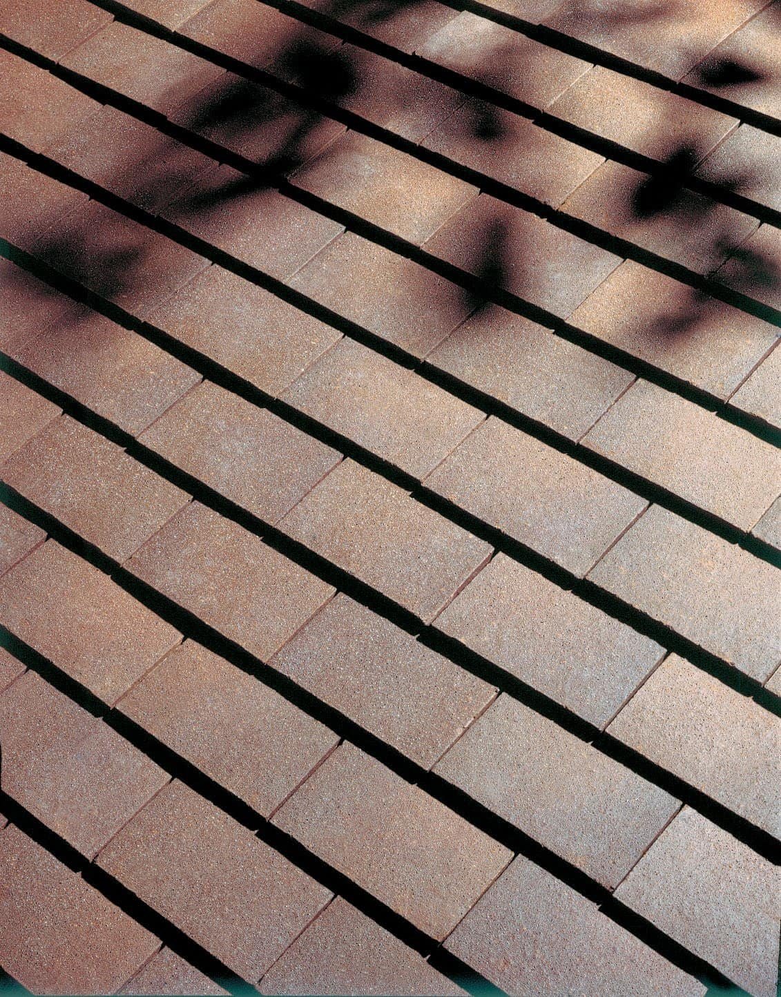 Dreadnought clay shingle tiles in Brown Heather with a sand finish surface